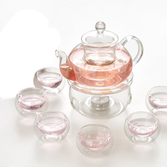 Glass Teapot with Infuser Warmer and 6 Double Cups. Delight in the elegance of tea rituals with this captivating glass tea set, modern design with timeless functionality.